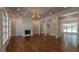Large living room featuring hardwood floors, a fireplace, recessed lighting, and ample natural light at 10765 Shallowford Rd, Roswell, GA 30075