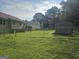 Fenced backyard showing a home, deck, shed, and grass at 54 Crestwood Dr, Dallas, GA 30157