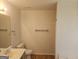 Clean bathroom featuring a toilet, sink, vanity, and a large mirror at 54 Crestwood Dr, Dallas, GA 30157