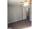 Spacious bedroom with wood flooring and ceiling fan fixture, ready for a new tenant or owner at 54 Crestwood Dr, Dallas, GA 30157
