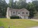 Inviting split-level home with a well-maintained lawn, two-car garage, and traditional architectural details at 54 Crestwood Dr, Dallas, GA 30157