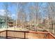 View from the wood deck overlooking the backyard featuring mature trees at 145 Windward Hls, Mcdonough, GA 30253