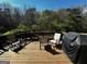 Inviting back deck with outdoor seating and a grill, perfect for enjoying the surrounding nature views at 2667 Hampton Park Dr, Marietta, GA 30062