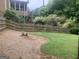 Spacious backyard with a wooden fence and mature landscaping; deck in background at 2667 Hampton Park Dr, Marietta, GA 30062