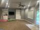 Finished basement with carpet, recessed lighting, and built-in shelving, perfect for entertaining at 2667 Hampton Park Dr, Marietta, GA 30062
