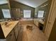 A lovely bathroom with double sinks, a bathtub, and a full shower with a glass door at 2667 Hampton Park Dr, Marietta, GA 30062