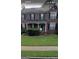 Charming two-story brick home with a classic design, black shutters, and well-maintained front yard at 2667 Hampton Park Dr, Marietta, GA 30062