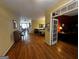 Sunlit open-plan living area with hardwood floors and seamless flow into dining and office spaces at 2667 Hampton Park Dr, Marietta, GA 30062