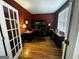 Stylish home office with rich red walls, hardwood floors, and ample desk and storage space at 2667 Hampton Park Dr, Marietta, GA 30062