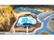 Aerial view of the community pool, pond, tennis courts, and clubhouse at 325 Silver Moon Dr, Loganville, GA 30052