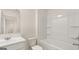 Sparkling bathroom features a tub, toilet, and sink with neutral colors, and a large mirror at 325 Silver Moon Dr, Loganville, GA 30052