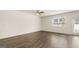 Bedroom with window, ceiling fan and hardwood floors at 325 Silver Moon Dr, Loganville, GA 30052