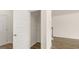 Open closet with wire shelving and white painted door at 325 Silver Moon Dr, Loganville, GA 30052
