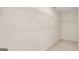 An empty walk-in closet with carpeted floors and wire shelving at 325 Silver Moon Dr, Loganville, GA 30052