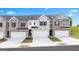 Charming townhomes showcasing unique exteriors, two-car garages, and well-maintained landscaping at 325 Silver Moon Dr, Loganville, GA 30052
