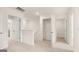 Upstairs hallway featuring multiple doorways, carpet, and linen closet at 325 Silver Moon Dr, Loganville, GA 30052