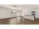 Living room featuring kitchen, window and hardwood floors at 325 Silver Moon Dr, Loganville, GA 30052