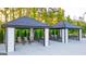 Outdoor seating area with covered cabanas and comfortable seating at 325 Silver Moon Dr, Loganville, GA 30052