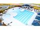 Aerial view of a pool with cabanas, tables, lounge chairs, and a splash pad at 325 Silver Moon Dr, Loganville, GA 30052