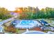 Aerial view showcasing a spacious community pool with recreational amenities including a playground at 325 Silver Moon Dr, Loganville, GA 30052