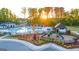 Aerial view of the pool, playground, and clubhouse at 325 Silver Moon Dr, Loganville, GA 30052