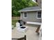 Cozy back patio with a built-in fire pit, seating, and outdoor storage, ideal for entertaining at 785 Ne South Pine St, Conyers, GA 30012