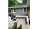 Back patio area featuring a fire pit, built-in benches, and outdoor cooler with easy access at 785 Ne South Pine St, Conyers, GA 30012