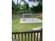 Spacious backyard featuring a level lawn, wooden fence, and concrete patio with gazebo frame at 785 Ne South Pine St, Conyers, GA 30012