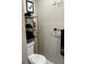 Bathroom features a toilet, black towels and a gray wall at 785 Ne South Pine St, Conyers, GA 30012