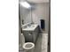 Bathroom featuring double sinks with granite countertops and a toilet at 785 Ne South Pine St, Conyers, GA 30012