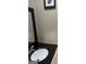 Bathroom with a black granite countertop, vessel sink, and black framed mirror at 785 Ne South Pine St, Conyers, GA 30012