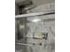 Modern bathroom with marble tile walls and a glass-enclosed bathtub at 785 Ne South Pine St, Conyers, GA 30012