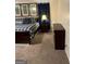 Well-lit bedroom featuring a cozy bed with dark wood furniture at 785 Ne South Pine St, Conyers, GA 30012