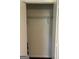 A walk-in closet features an installed wire shelf for optimal storage at 785 Ne South Pine St, Conyers, GA 30012