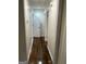 Hallway with dark wood floors and white walls at 785 Ne South Pine St, Conyers, GA 30012