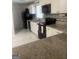 Modern kitchen featuring white cabinets, black appliances, granite countertops, and marble floors, perfect for cooking and entertaining at 785 Ne South Pine St, Conyers, GA 30012