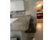 Open kitchen layout with granite countertops, seating, and access to a cozy bedroom, creating a modern, inviting space at 785 Ne South Pine St, Conyers, GA 30012