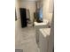 Efficient laundry room featuring modern machines and ample storage space, blending functionality with style at 785 Ne South Pine St, Conyers, GA 30012