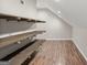 Finished attic featuring hardwood floors and shelving at 19 Indian Bluff Dr, Sharpsburg, GA 30277