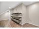 Finished attic featuring hardwood floors and wood shelving at 19 Indian Bluff Dr, Sharpsburg, GA 30277
