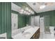 Bathroom features an extended double vanity, large mirror, and walk-in shower at 19 Indian Bluff Dr, Sharpsburg, GA 30277