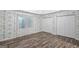 Bedroom with two closets and hardwood style flooring at 19 Indian Bluff Dr, Sharpsburg, GA 30277