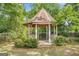 Charming gazebo surrounded by lush foliage offers a peaceful retreat in a well-maintained backyard at 19 Indian Bluff Dr, Sharpsburg, GA 30277