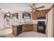 Traditional kitchen with light countertops, wood cabinets, and black appliances at 19 Indian Bluff Dr, Sharpsburg, GA 30277