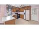 Traditional kitchen with light countertops, wood cabinets, and black appliances at 19 Indian Bluff Dr, Sharpsburg, GA 30277