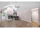 Bright living room featuring vaulted ceilings, fireplace, and hardwood floors at 19 Indian Bluff Dr, Sharpsburg, GA 30277