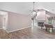Bright living room featuring vaulted ceilings, fireplace, and hardwood floors at 19 Indian Bluff Dr, Sharpsburg, GA 30277