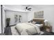 Modern bedroom featuring a ceiling fan, neutral decor, and a door leading to the outside at 5490 Chemin De Vie, Sandy Springs, GA 30342