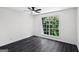 Bright bedroom featuring a window view and ceiling fan at 5490 Chemin De Vie, Sandy Springs, GA 30342