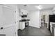 Bright and modern kitchen with stainless steel appliances, white cabinets, and sleek granite countertops at 5490 Chemin De Vie, Sandy Springs, GA 30342